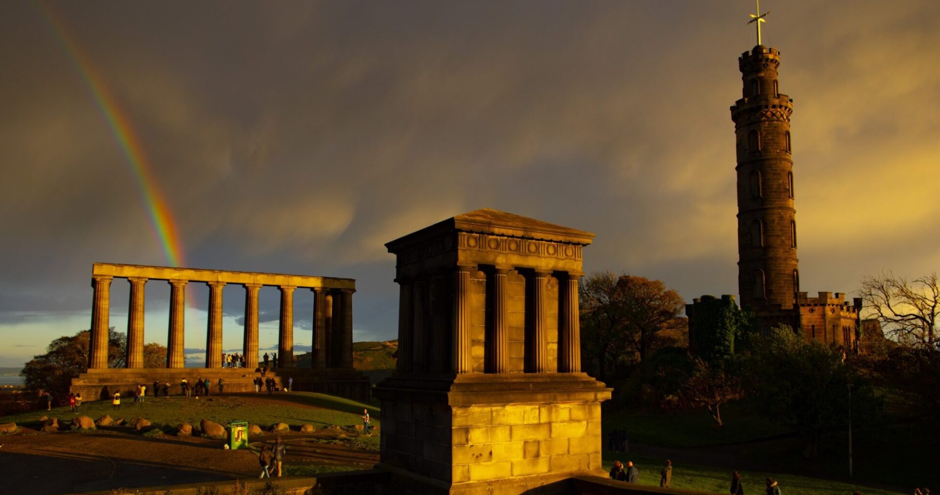 National and Playfair Monuments Nelsons column evening golden light double rainbow