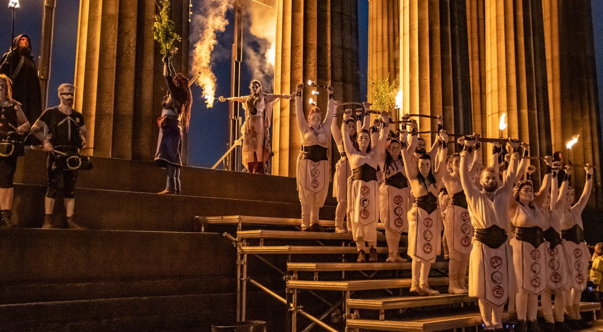 Beltane Fire Society on steps of the National Monument.