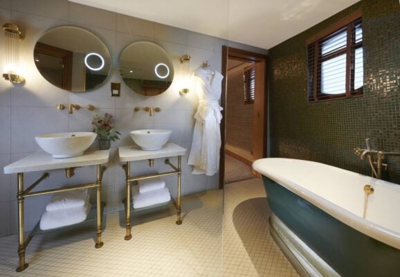 The Skerryvore Suite's opulent bathroom with free-standing roll-top bath, fluffy bathrobes and wash basins. , Jeremy Rata