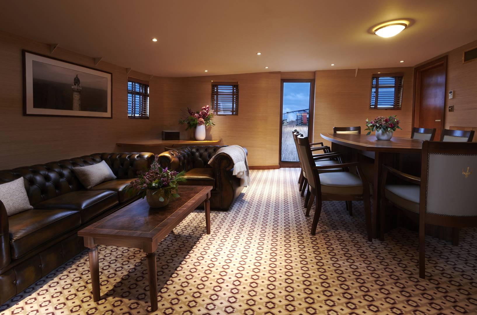 Inside Skerryvore Suite, with leather armchairs, a coffee table and large dining table and chairs. , Jeremy Rata