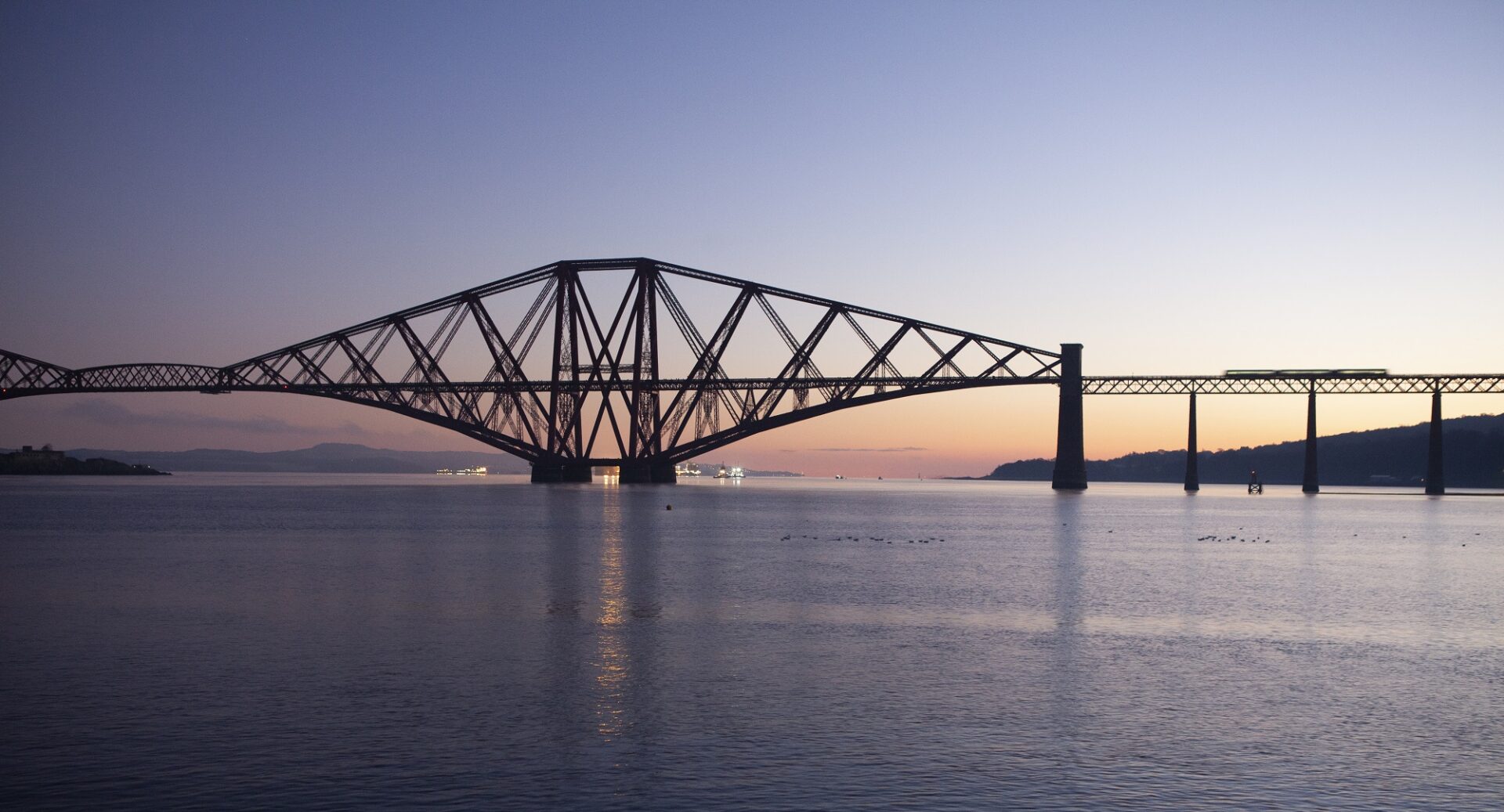 Sunrise behind the Forth Bridge