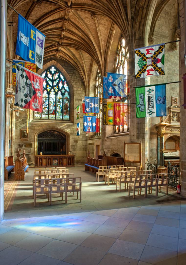 Heraldic Flags hanging in a church aisle , Peter Backhouse