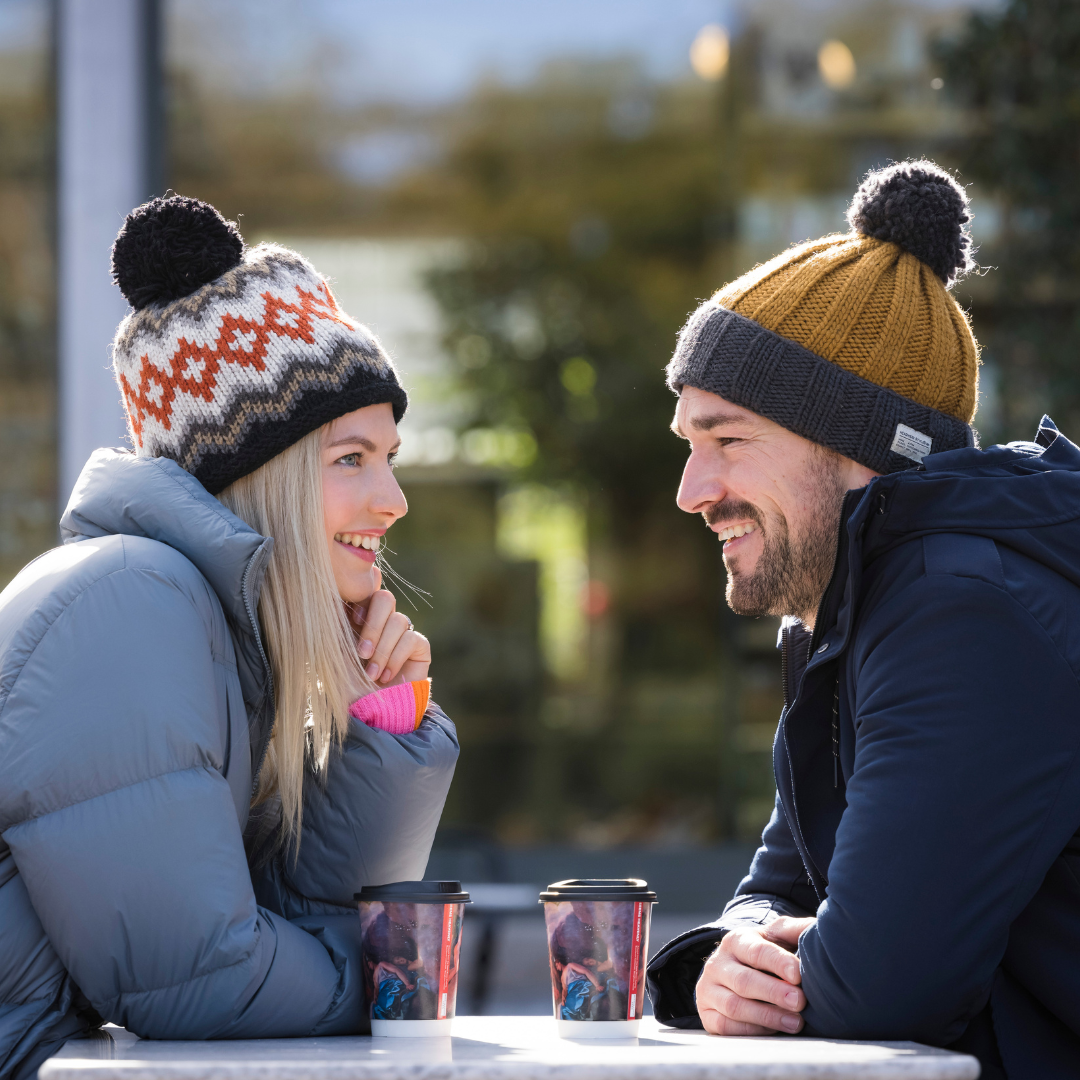 Couple enjoying takeaway coffee at Dalkeith Country Park, Dalkeith Country Park