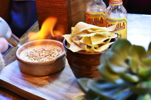 Spicy Chilli Con Queso fondue with salted tortilla chips