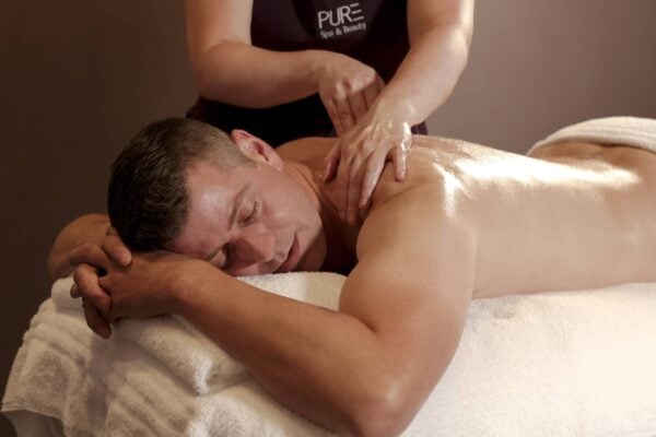 Man getting massage at PURE Spa & Beauty