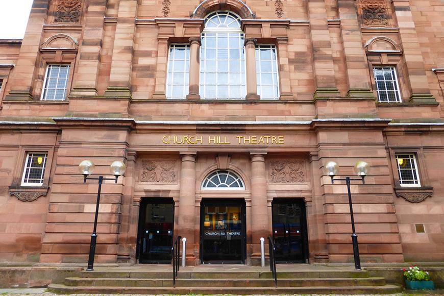 The red sandstone main entrance to Church Hill Theatre