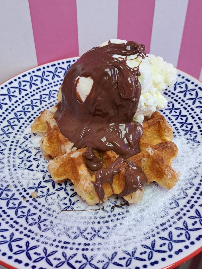 A hot waffles served  with warm nutella