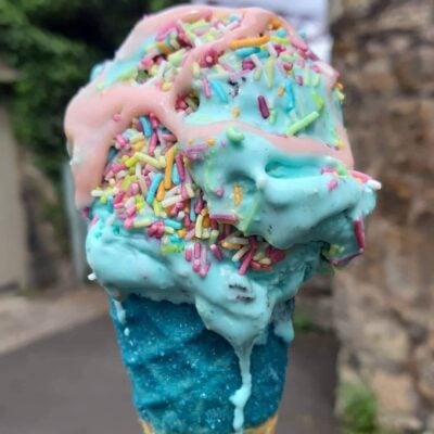 A unicone with Bubblegum  ice cream and rainbow  sprinkles