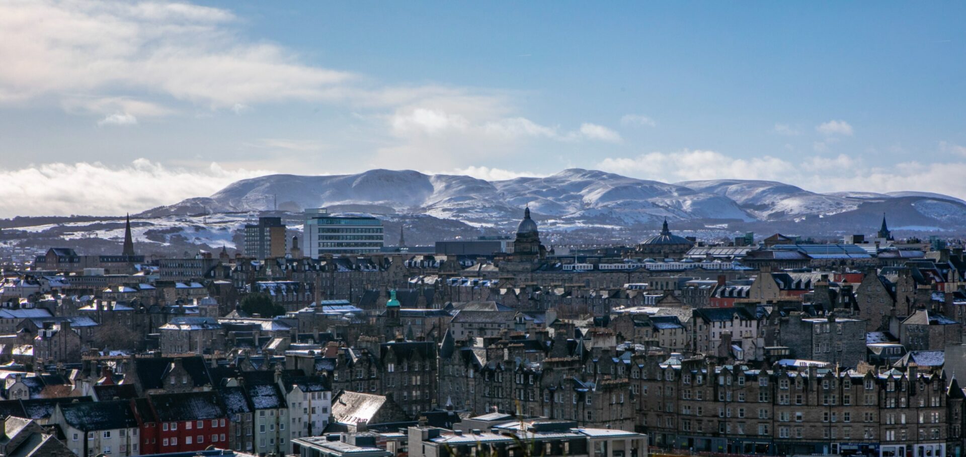Old town with Pentland Hills and snow