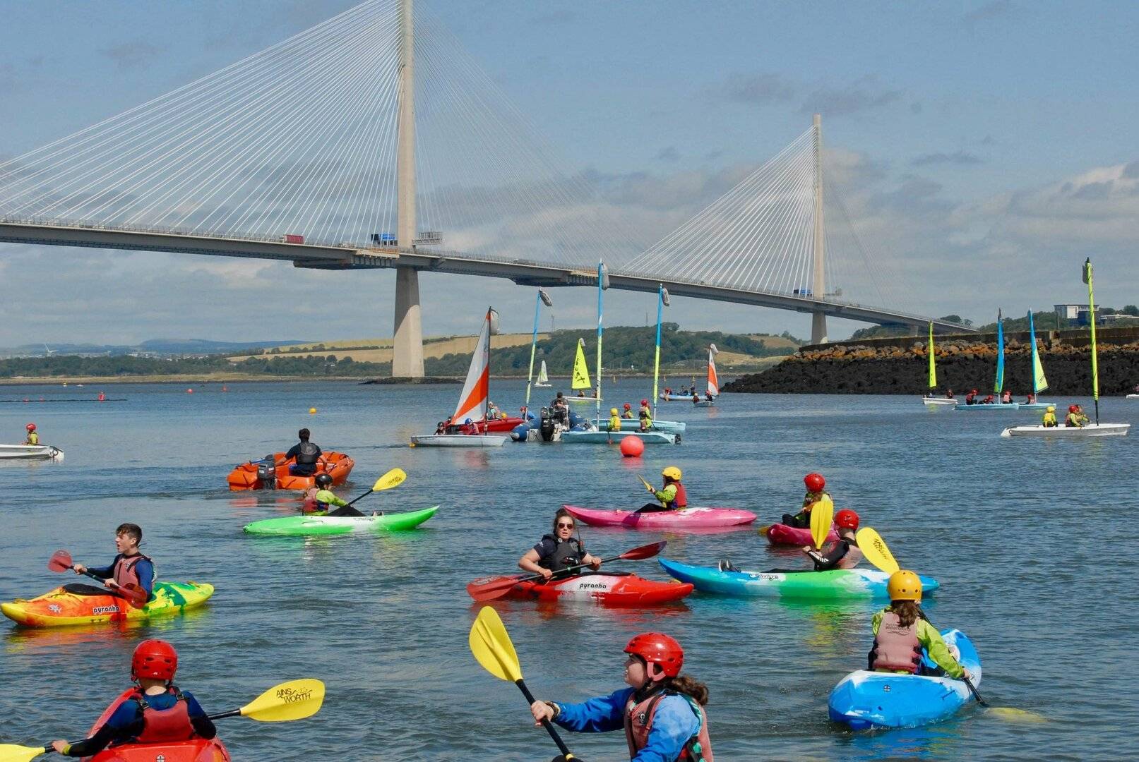 Kayaks and Dinghy sailing under the Queensferry Crossing