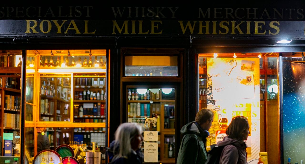 Royal Mile Whiskies shop front at night