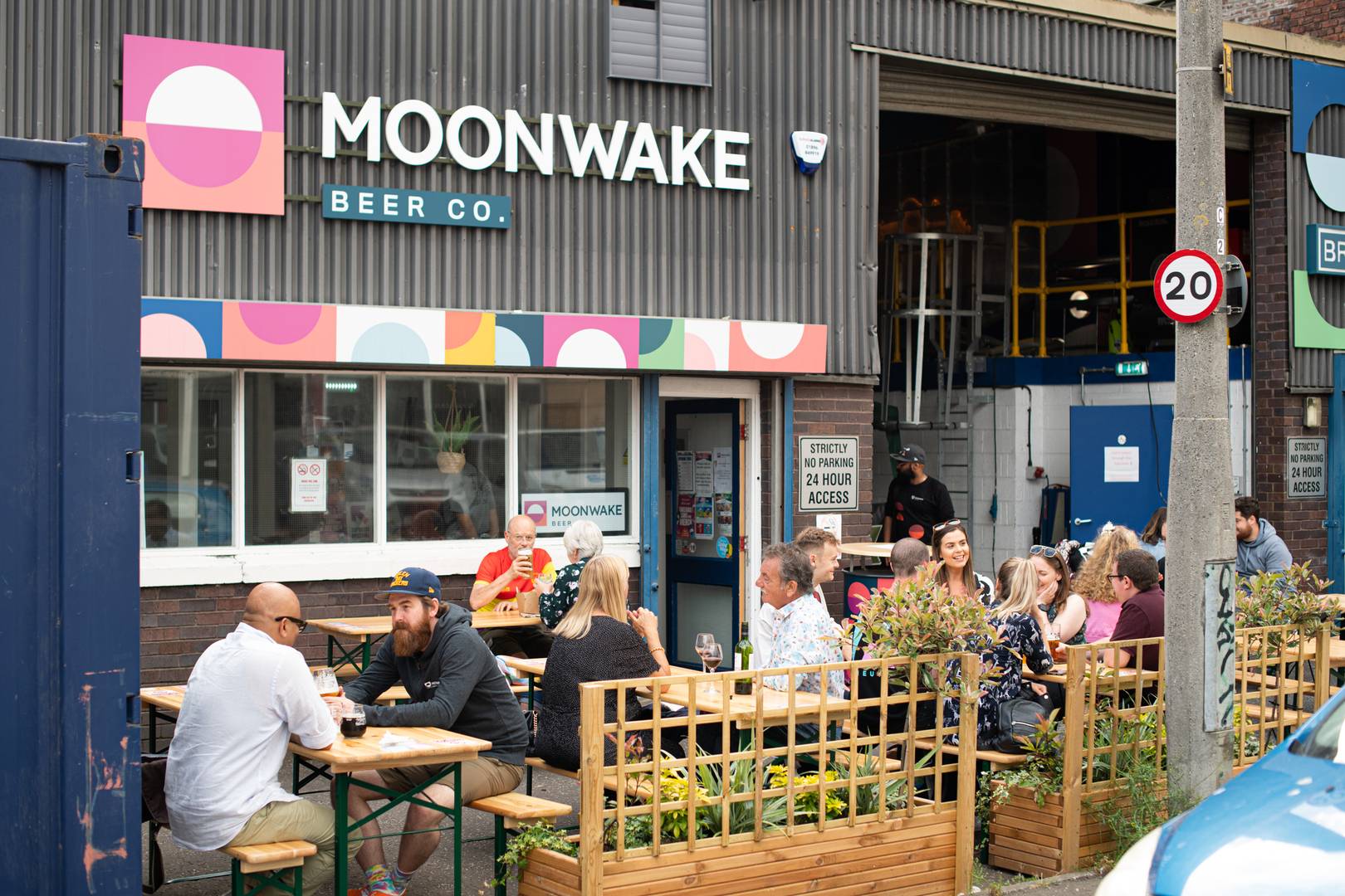 People sat outside of Moonwake brewery and taproom, Moonwake Beer Co. 2023