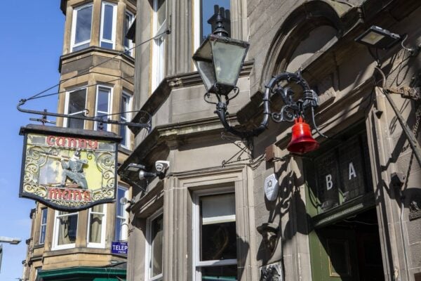 Image of the outside of the Canny Mans with original pub sign