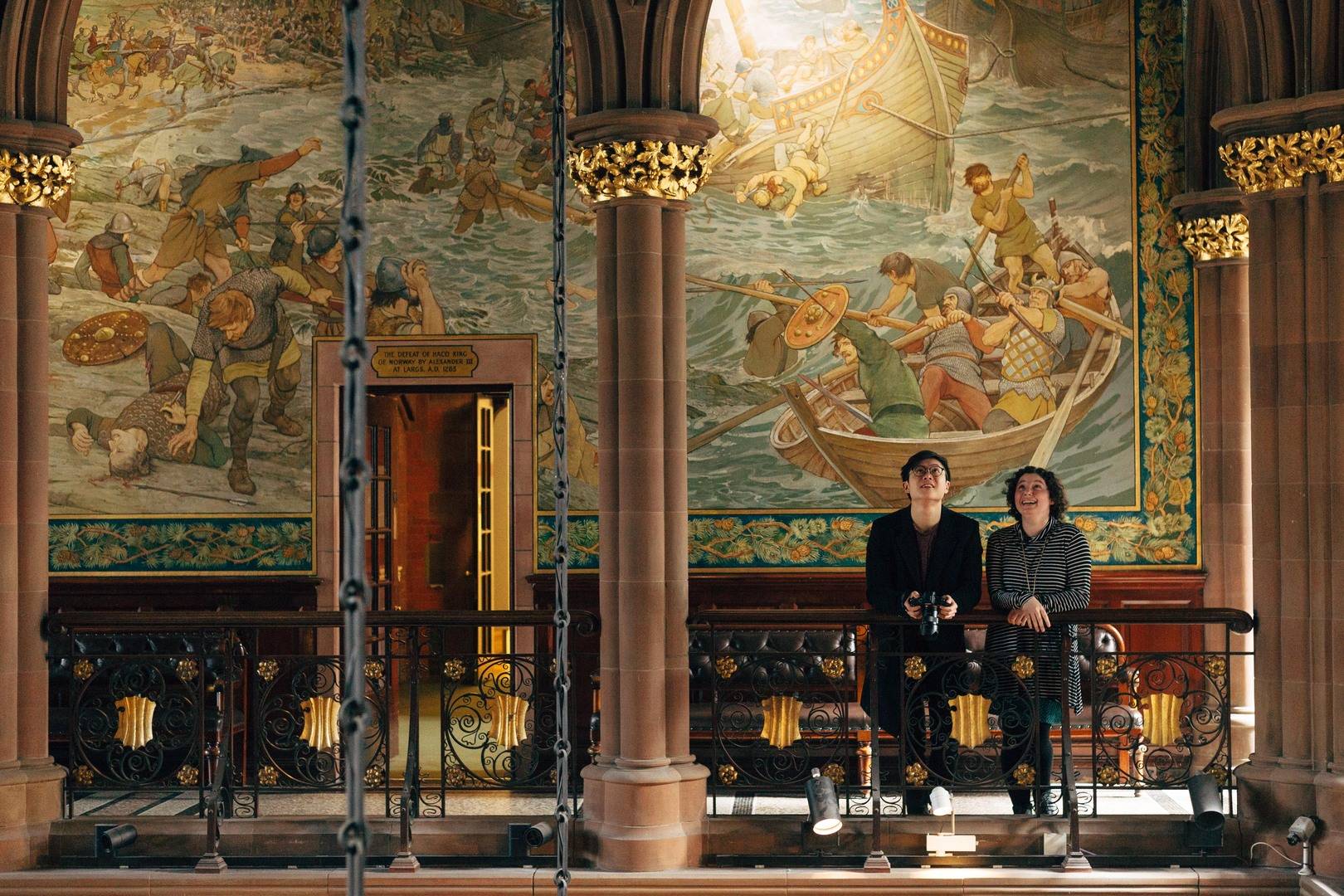 two people looking in awe at the interior of the great hall in the gallery,© National Galleries of Scotland