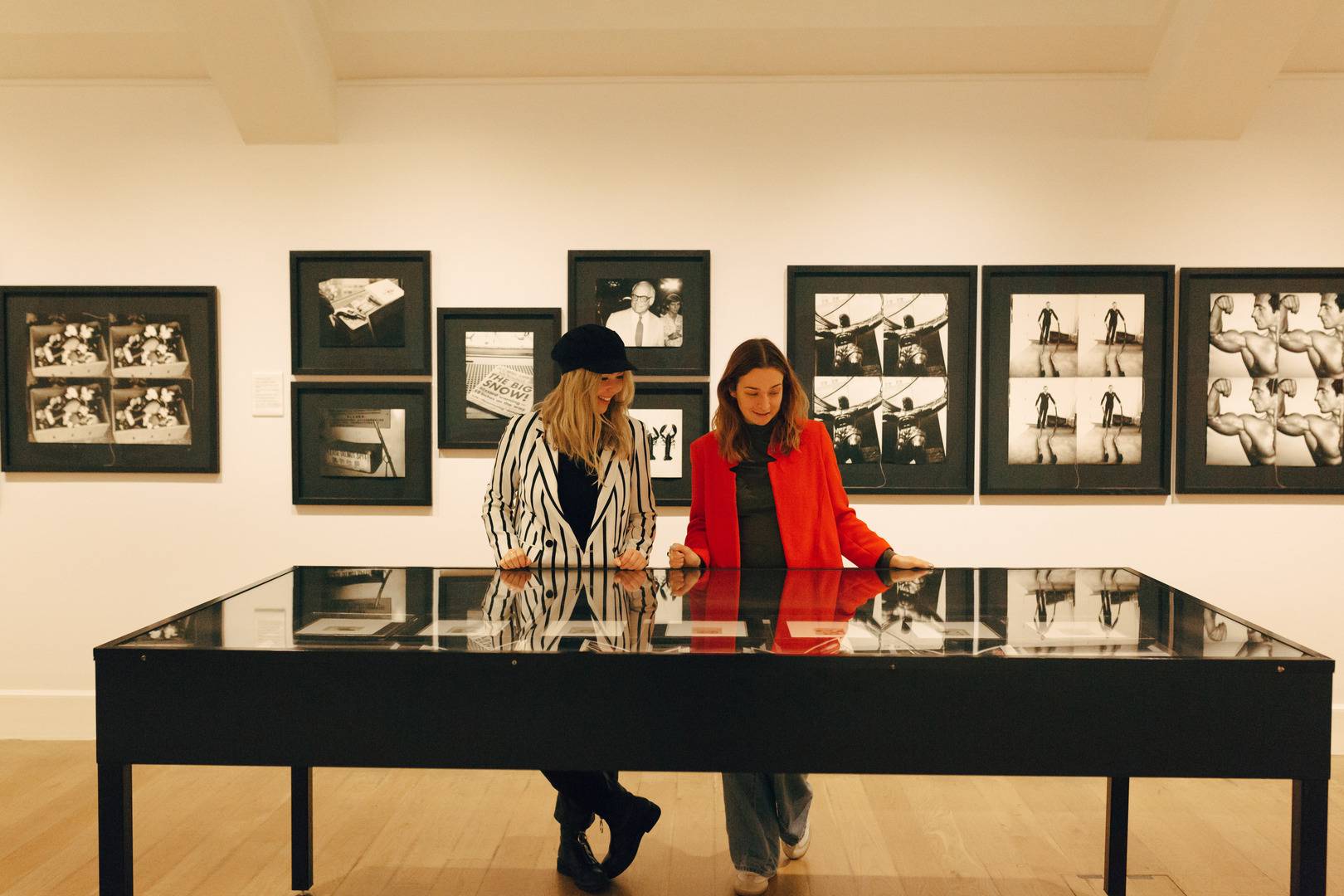 Two women look at an exhibition in the gallery,© National Galleries Scotland