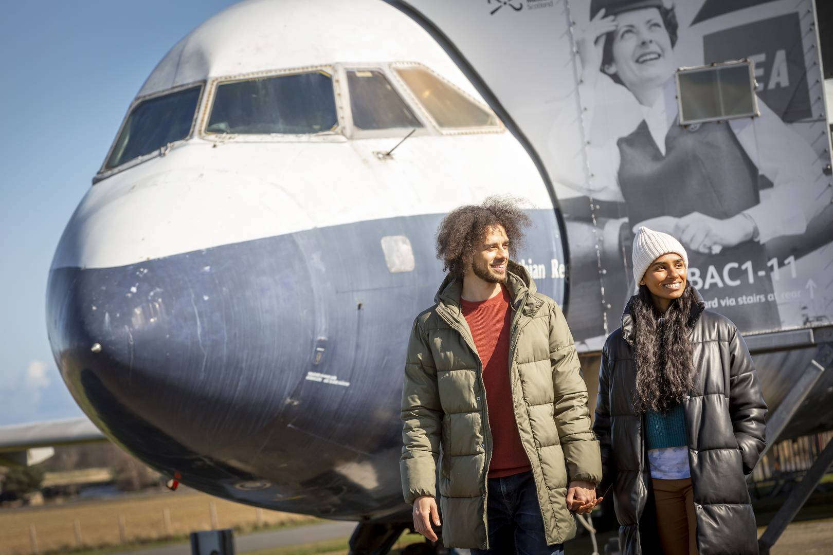Two visitors in front of the BAC 1-11 aircraft outside at the National Museum of Flight , Image © Ruth Armstrong Photography