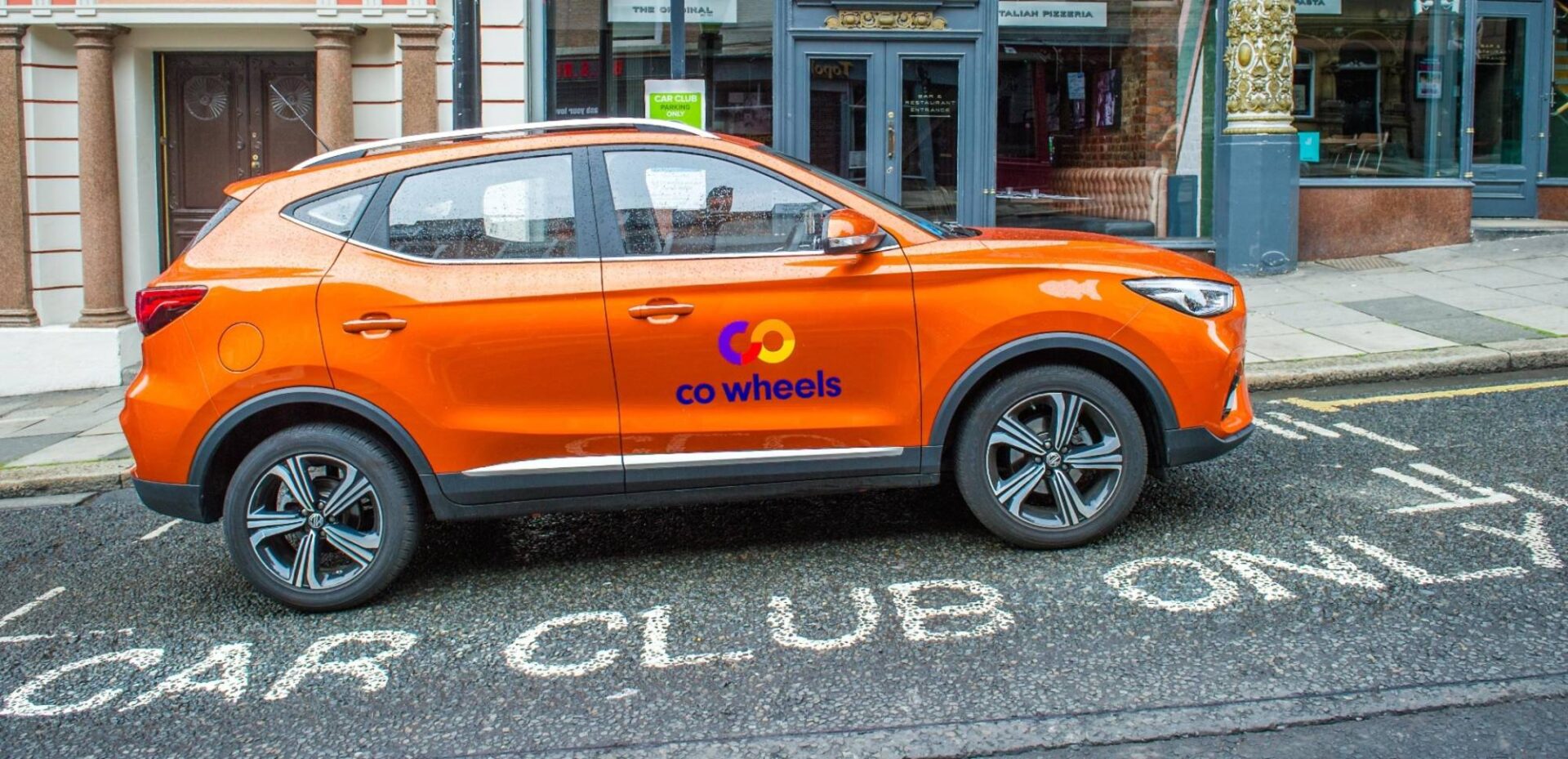 Co Wheels car parked in car club only space long street