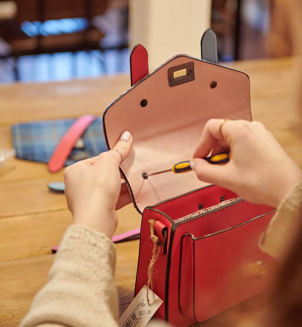 Person making a bag at Islander Bag Workshop Experience