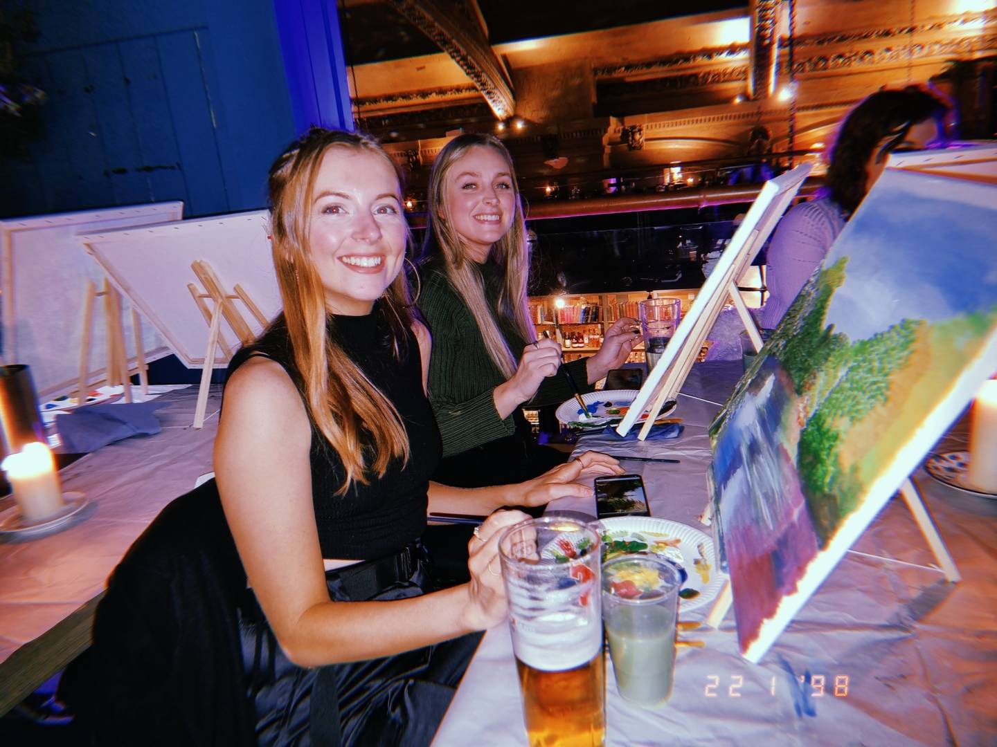 Girls smiling and painting