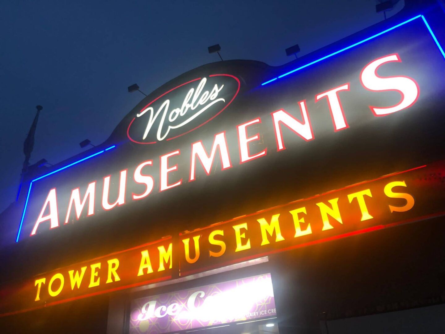 Noble's Tower Amusements exterior neon sign at night