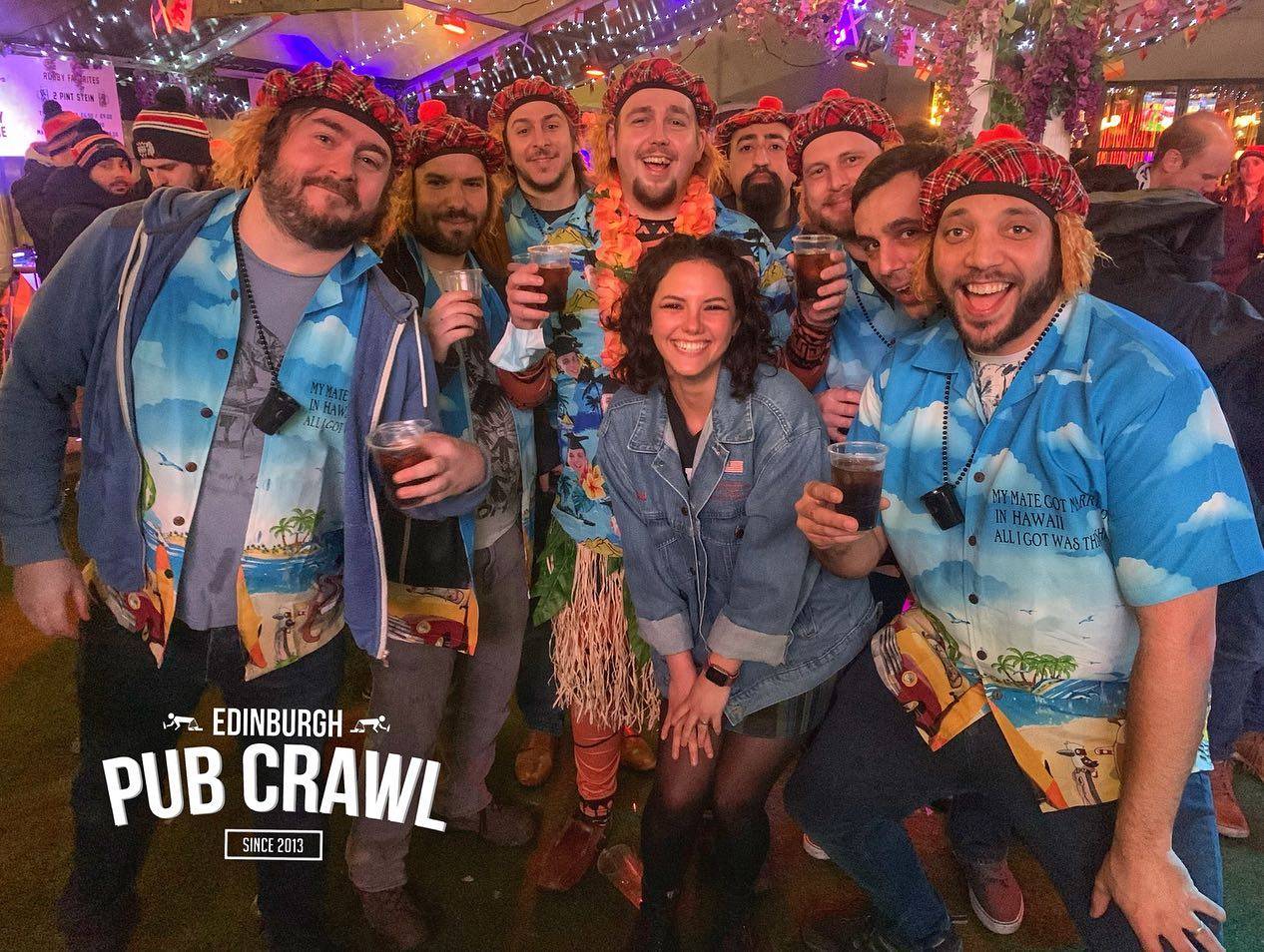 Group of people wearing funny hats and shirts taking part in Edinburgh Pub Crawl