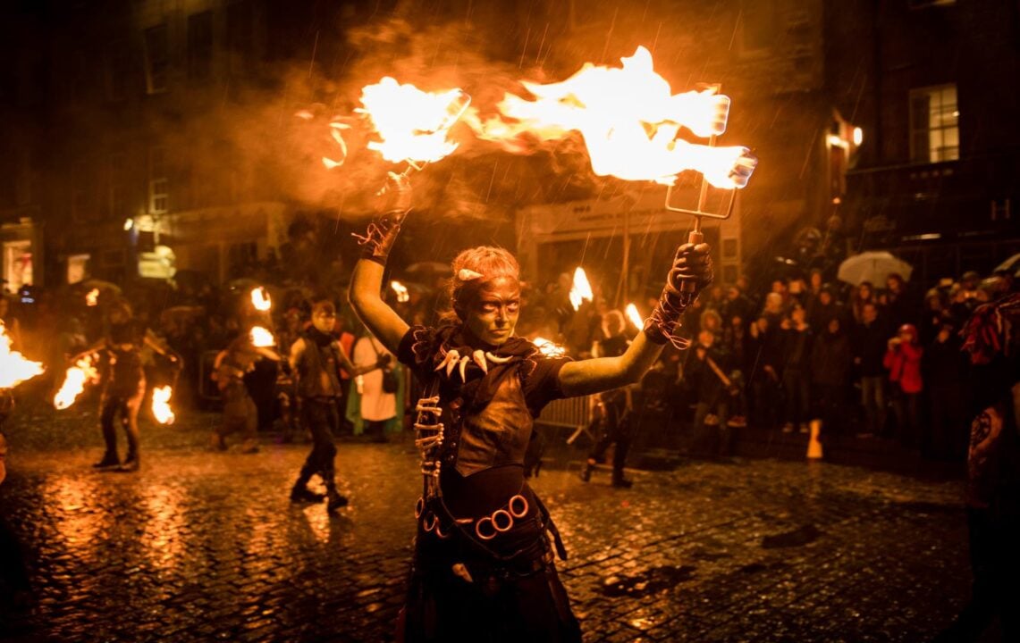 a Fire thrower taking part at the Samhuinn fire Festival