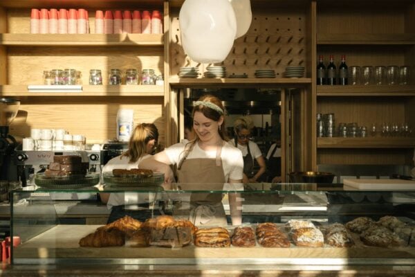 Happy faces all around. Our team serving customers from our display, full of the daily baked pastries, Patina Edinburgh