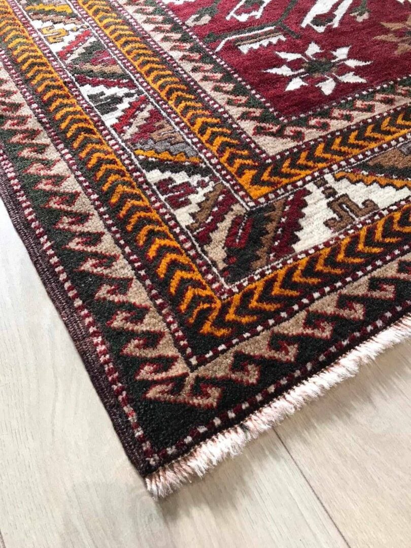 Corner of rug with alternating patterns