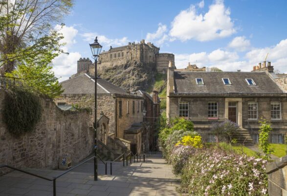 Image of The Vennel and Edinburgh Castle in background during Summer