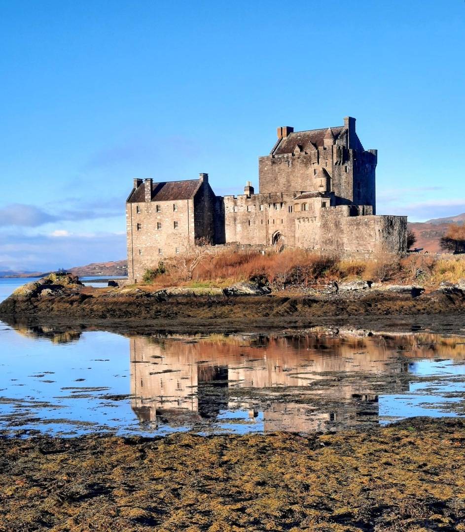 Eilean Donan Castle pictured in front of a clear blue sky
