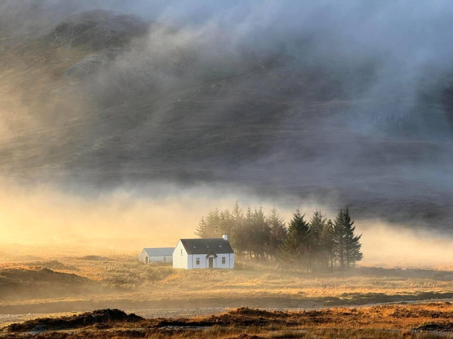 Single white house standing alone in Scottish Highlands