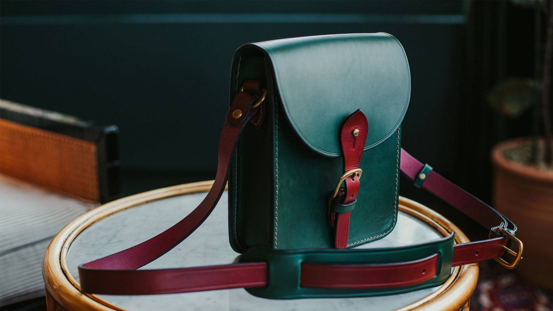 Book bag in Italian saddle two tones green and burgundy.