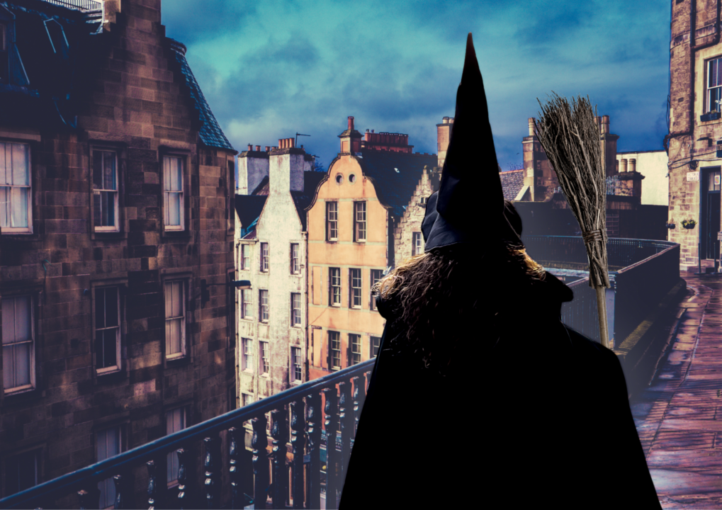 A witch with black pointy hat and broom stick looking towards the old town medieval buildings of Edinburgh.,© Enthral Group Ltd.