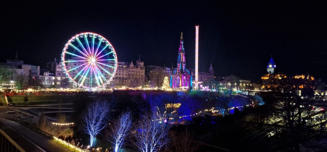 Edinburgh Christmas, cityscape at night with festive lights.