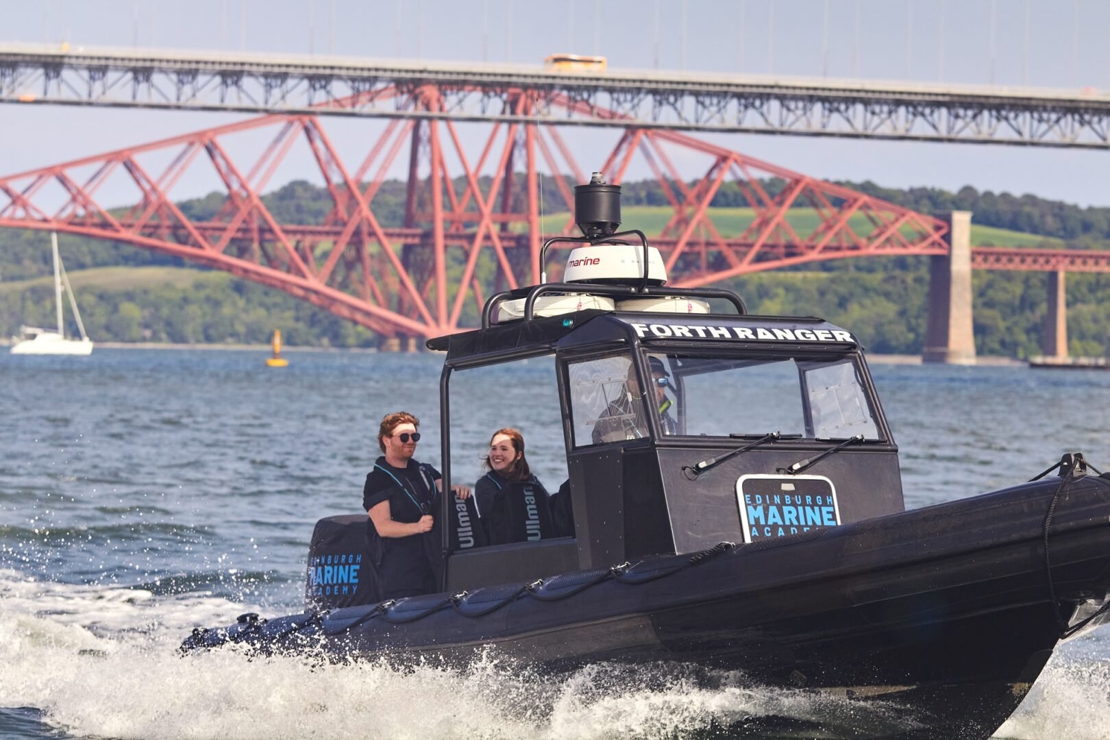 young couple on rib with forth bridge behind