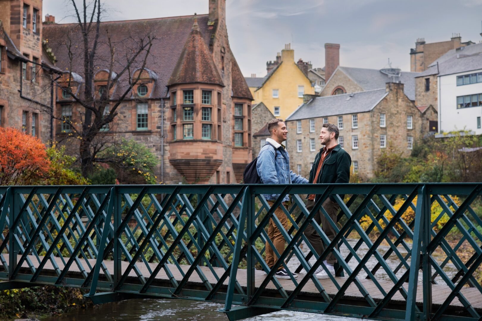 Young couple on Bridge with Dean Village as back drop