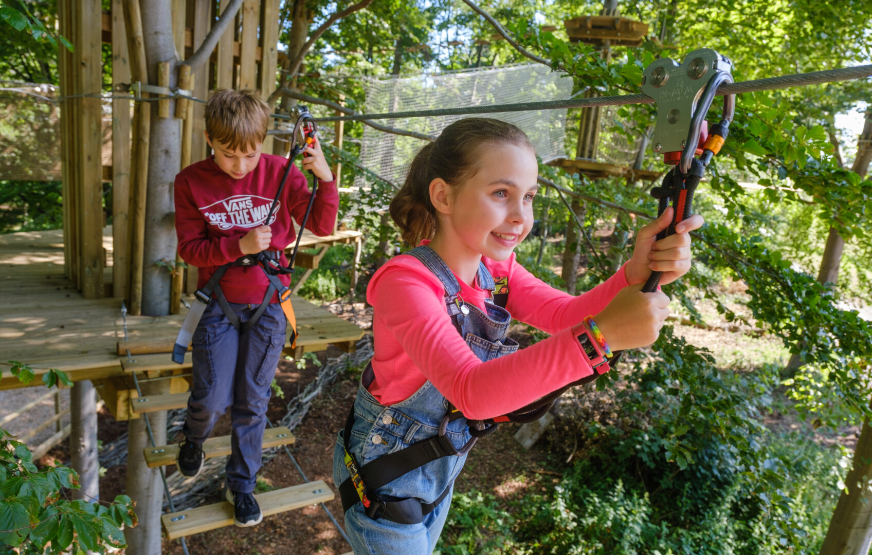 Girl and Boy on Tree Top Trail at Go Ape