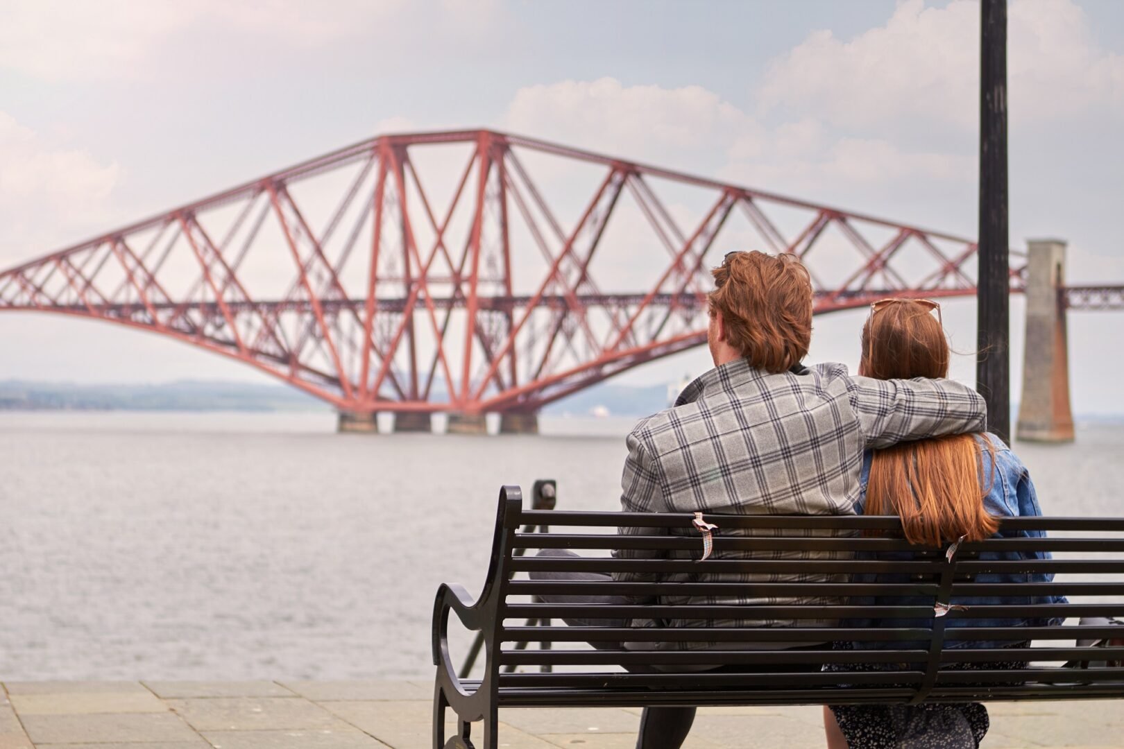 Young Couple on Bench with Forth Bridge in background