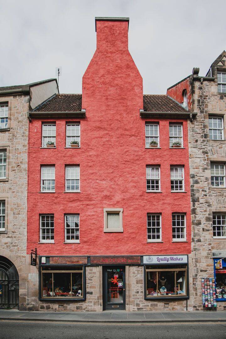 Gordon Nicolson Kiltmakers eyecatching red tenement building on the Canongate,© Gordon Nicolson Kiltmakers