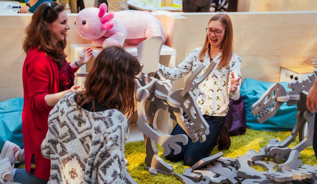 Ladies building foam dinosaurs at the Edinburgh Science Festival after hours event
