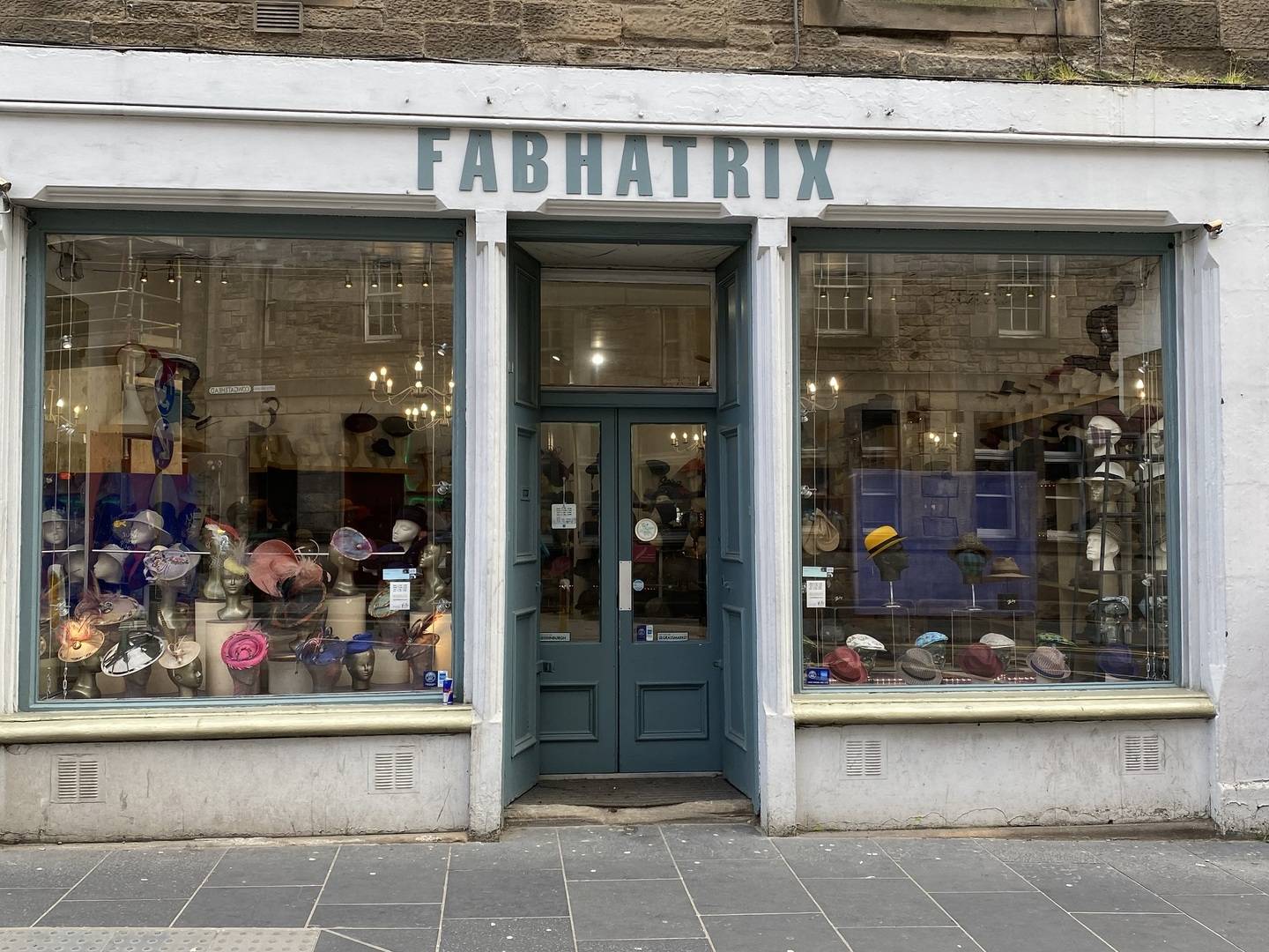 Image of FabHatrix window full of hats on stands