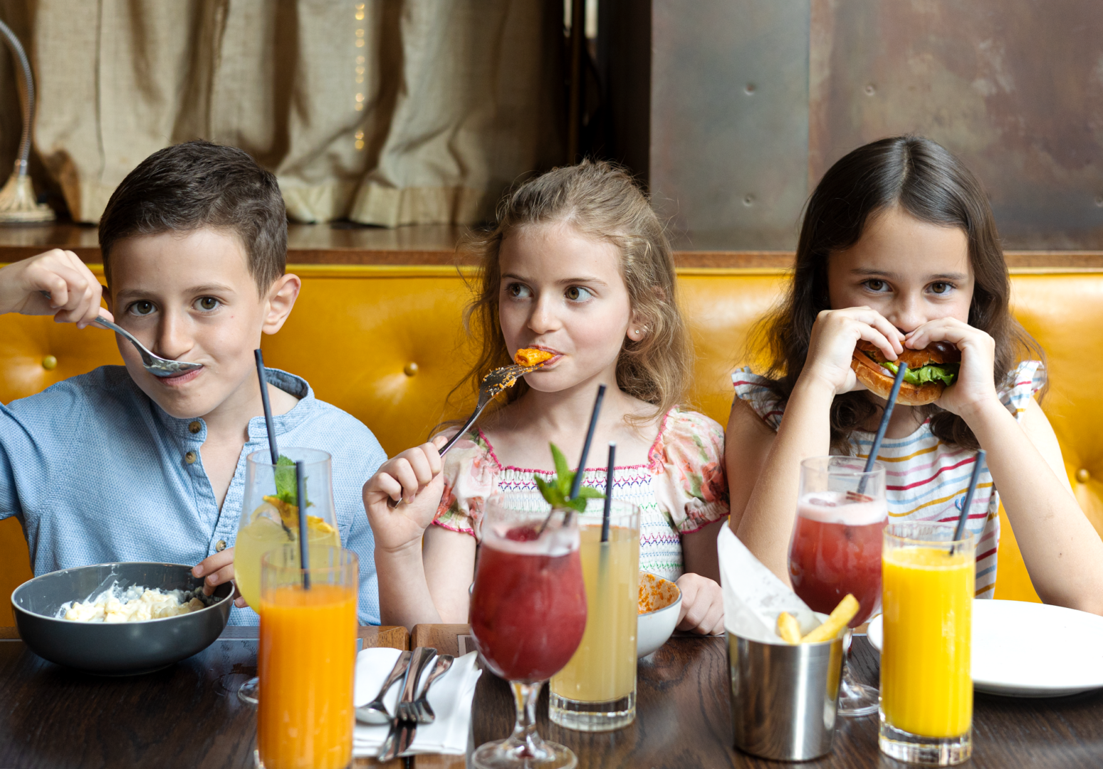Kids eating food at Bread Street Kitchen and Bar