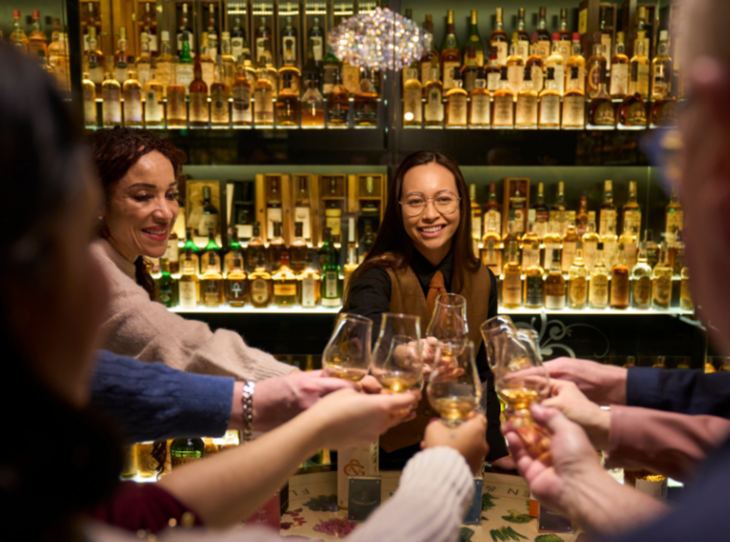 Tour guide and visitors within the whisky collection at The Scotch Whisky Experience,© The Scotch Whisky Experience