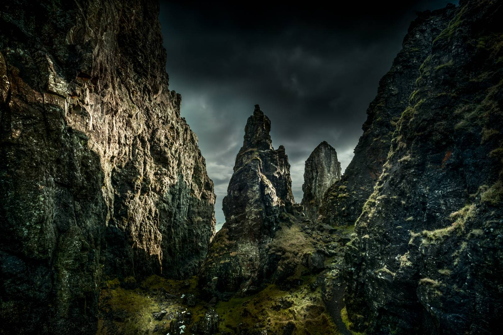 Dramatic landscape with rocky pinnacles and dark sky. Scotland,© Chris Close