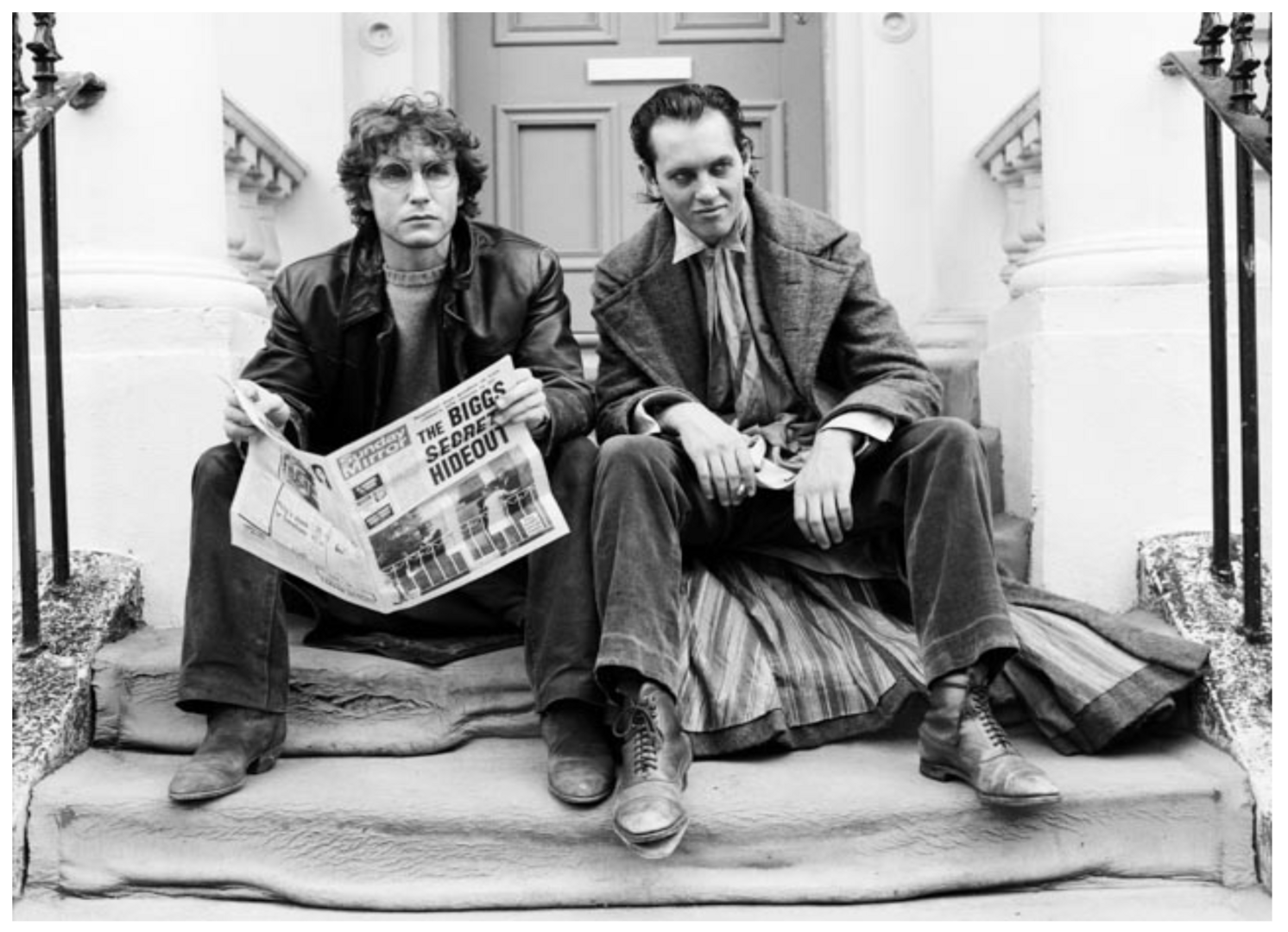 Film still from Withnail and I featuring Richard E Grant and Paul McGann sitting on steps in London,© Murray Close