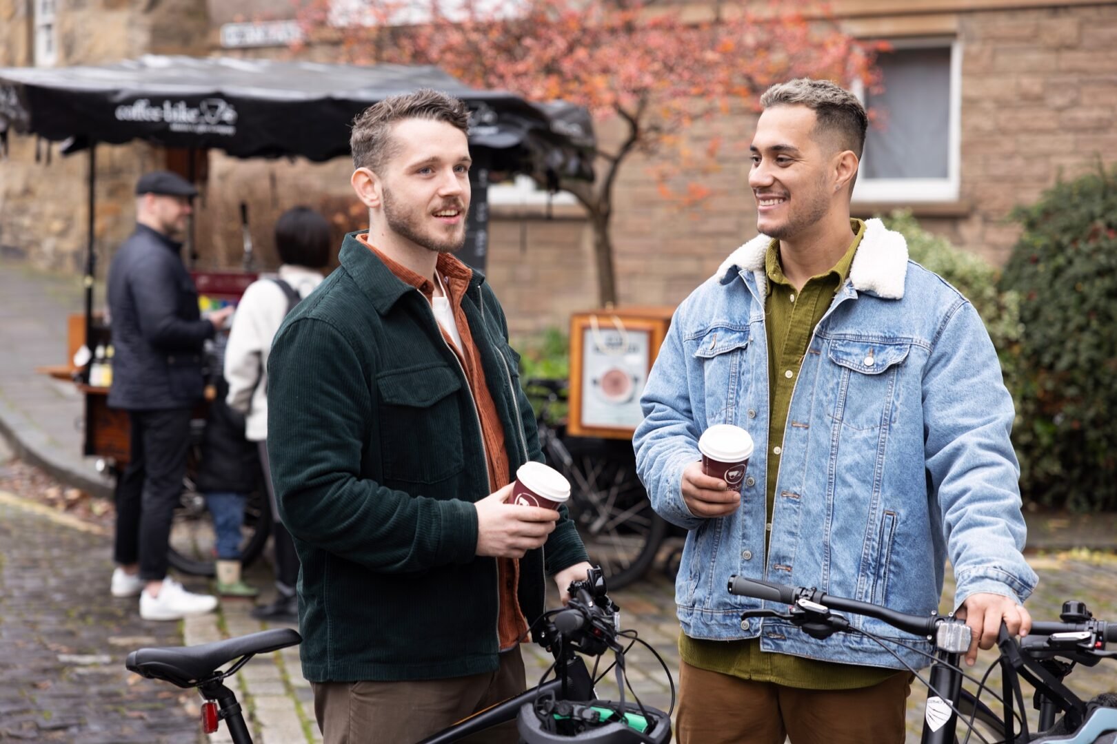 Two men enjoying a takeaway coffee in Dean Village