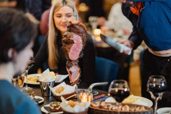 Waiter carving meat at Rio Brazilian Steakhouse