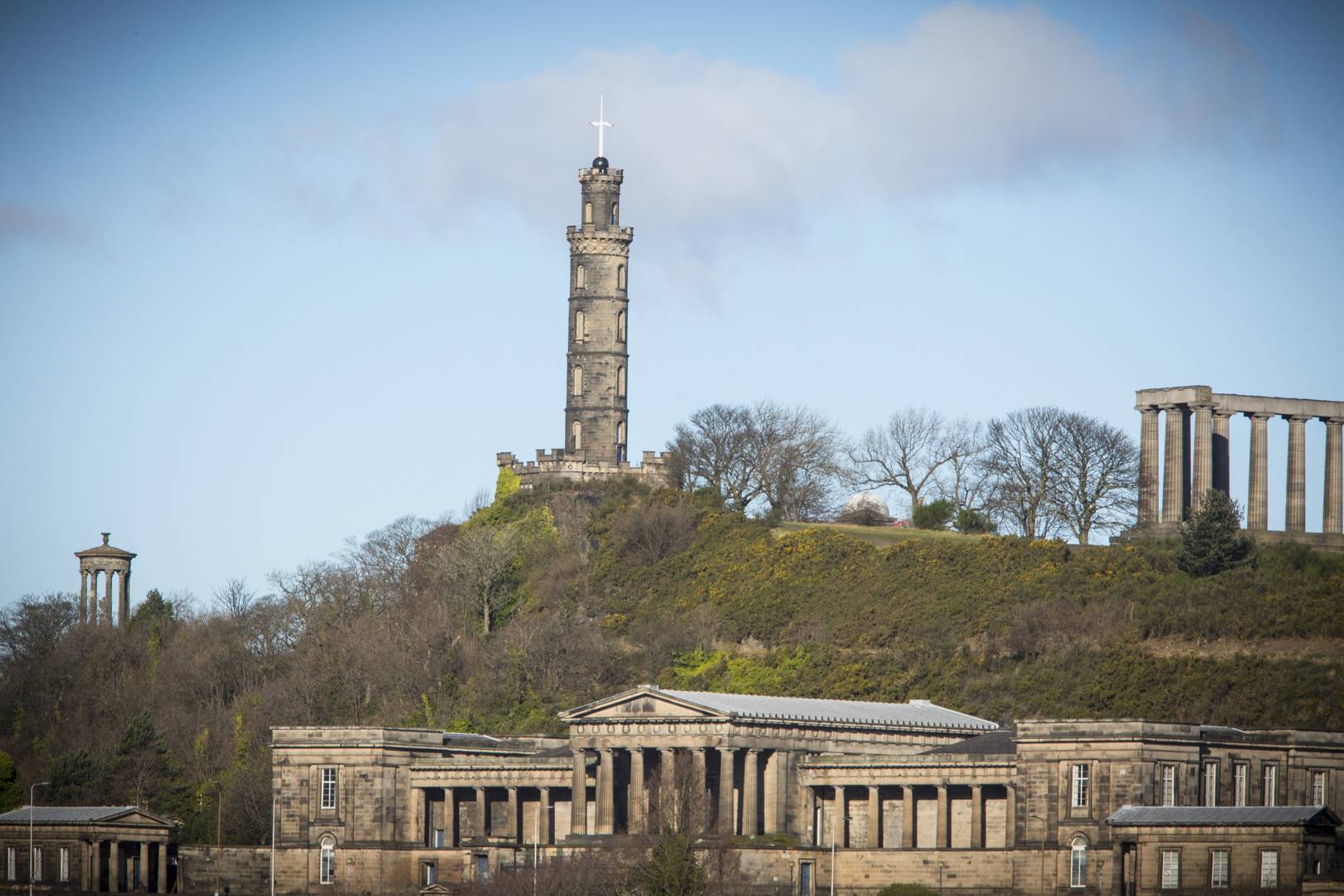 Picture of Nelson Monument on Calton Hill with a blue sky in the background.