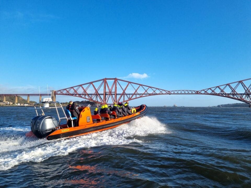 Boat on Firth of Forth from Edinburgh Marine Academy with Forth Bridge in background