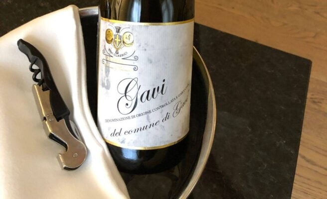 A bottle of Gavi wine and a corkscrew